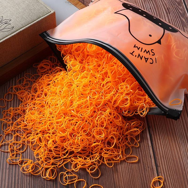 orange elastic hair ties in fabric